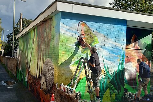 Mural being painted at the Upper High Street Car Park